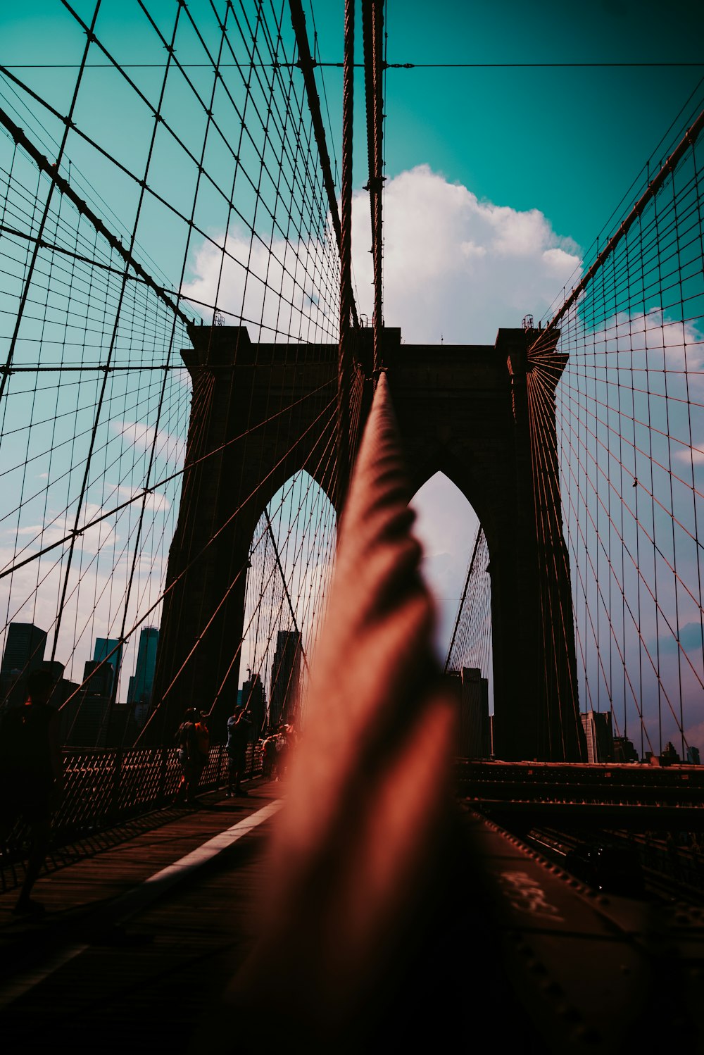 low-angle photography of a bridge under a blue sky