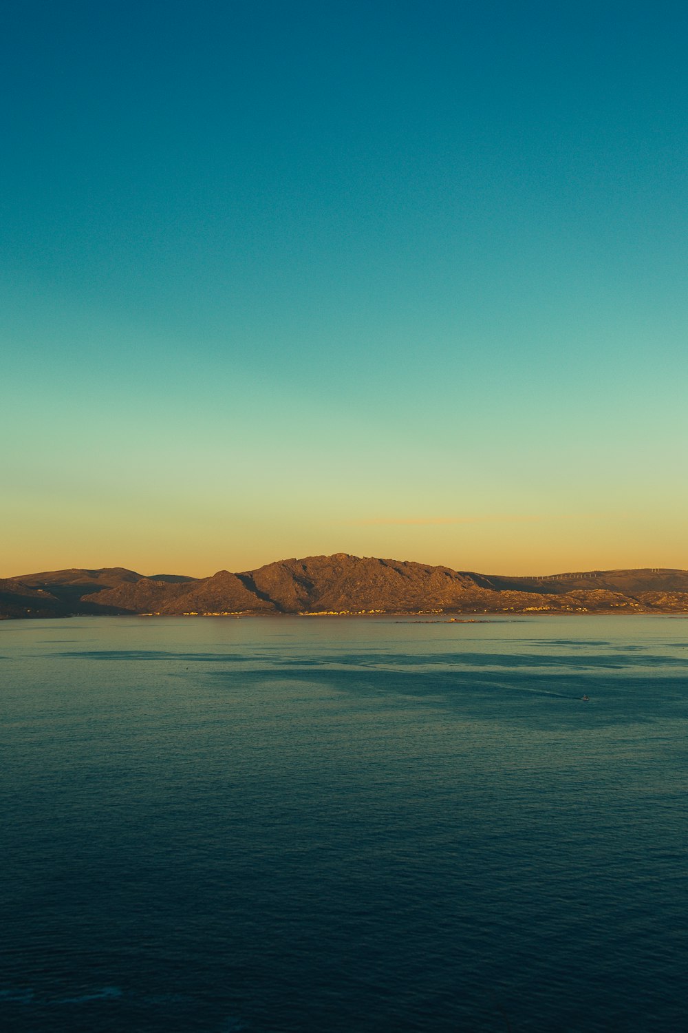 sea and island during day