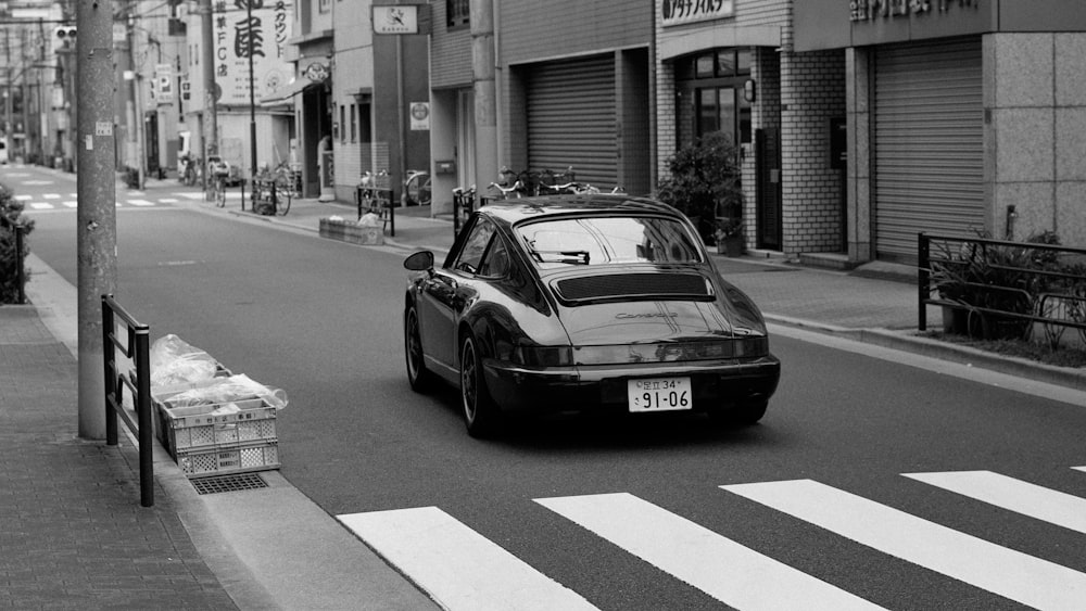 coupe near Ped Xing between buildings