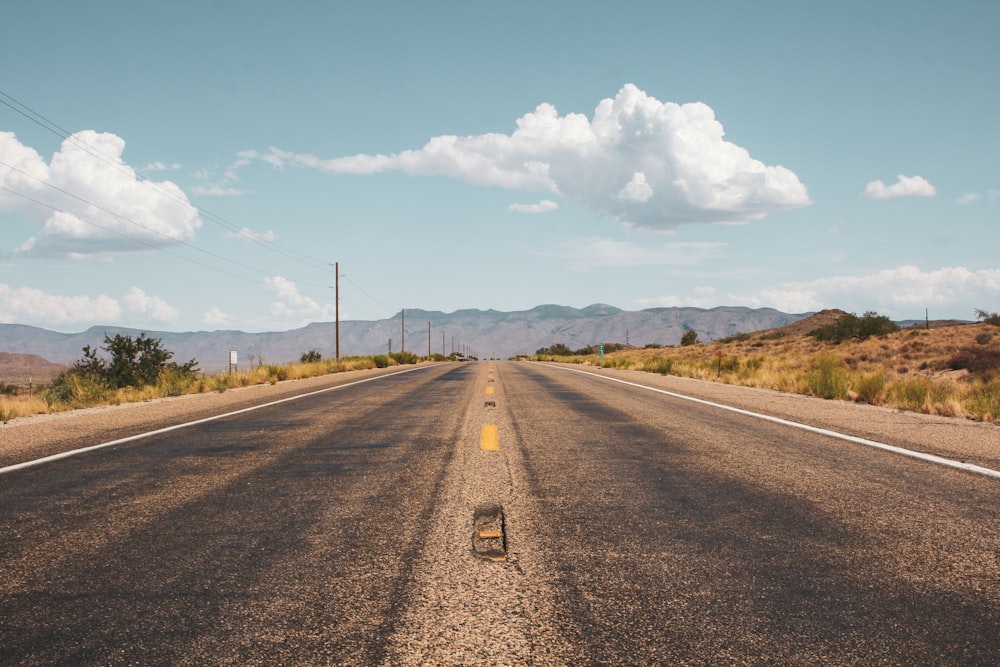 empty road under blue sky