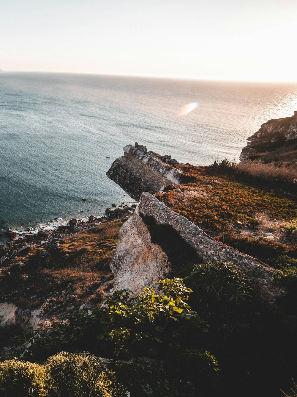 rocky and grass island during day