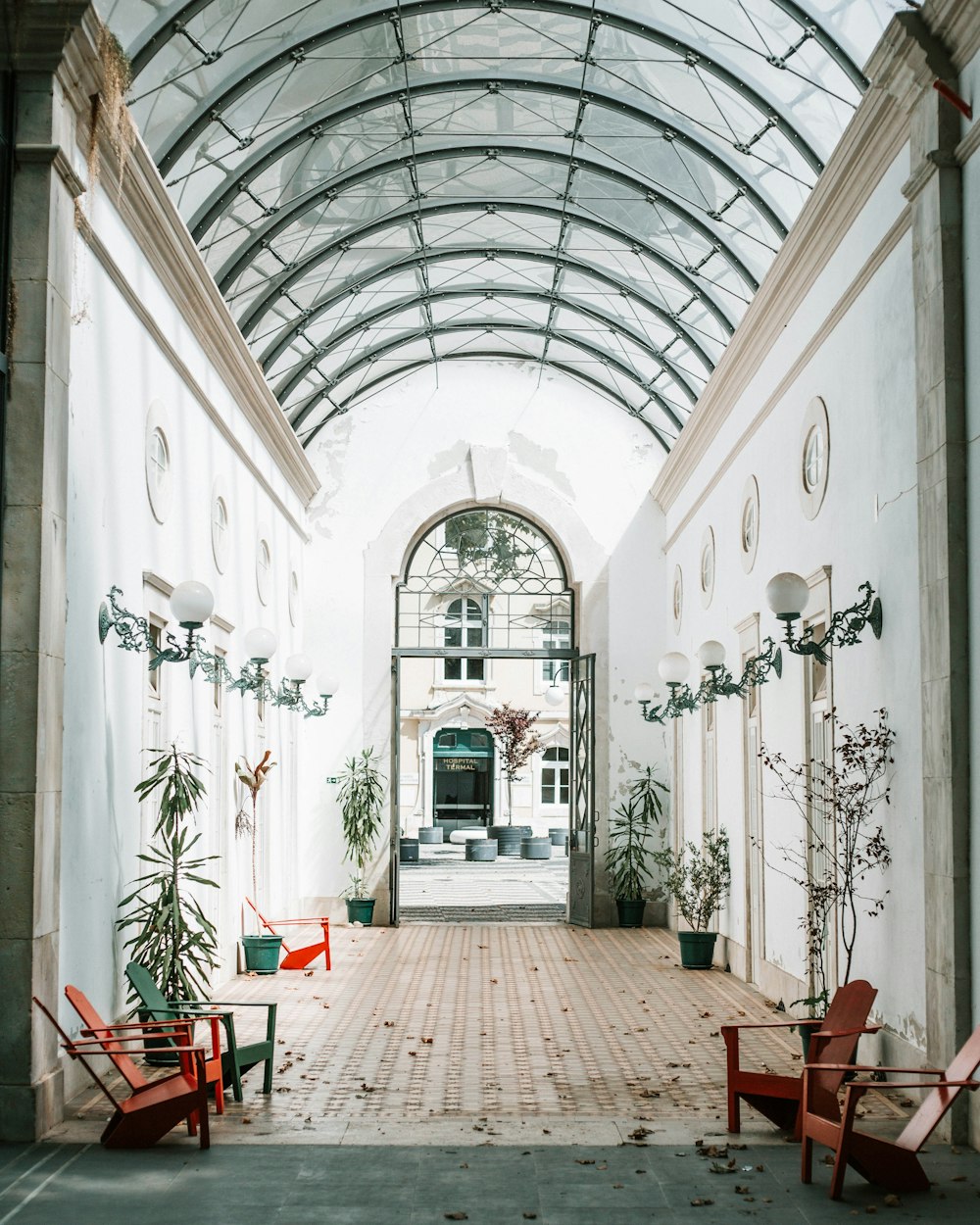 empty brown and green chairs near walls