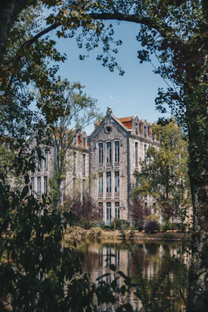 building near pond during day