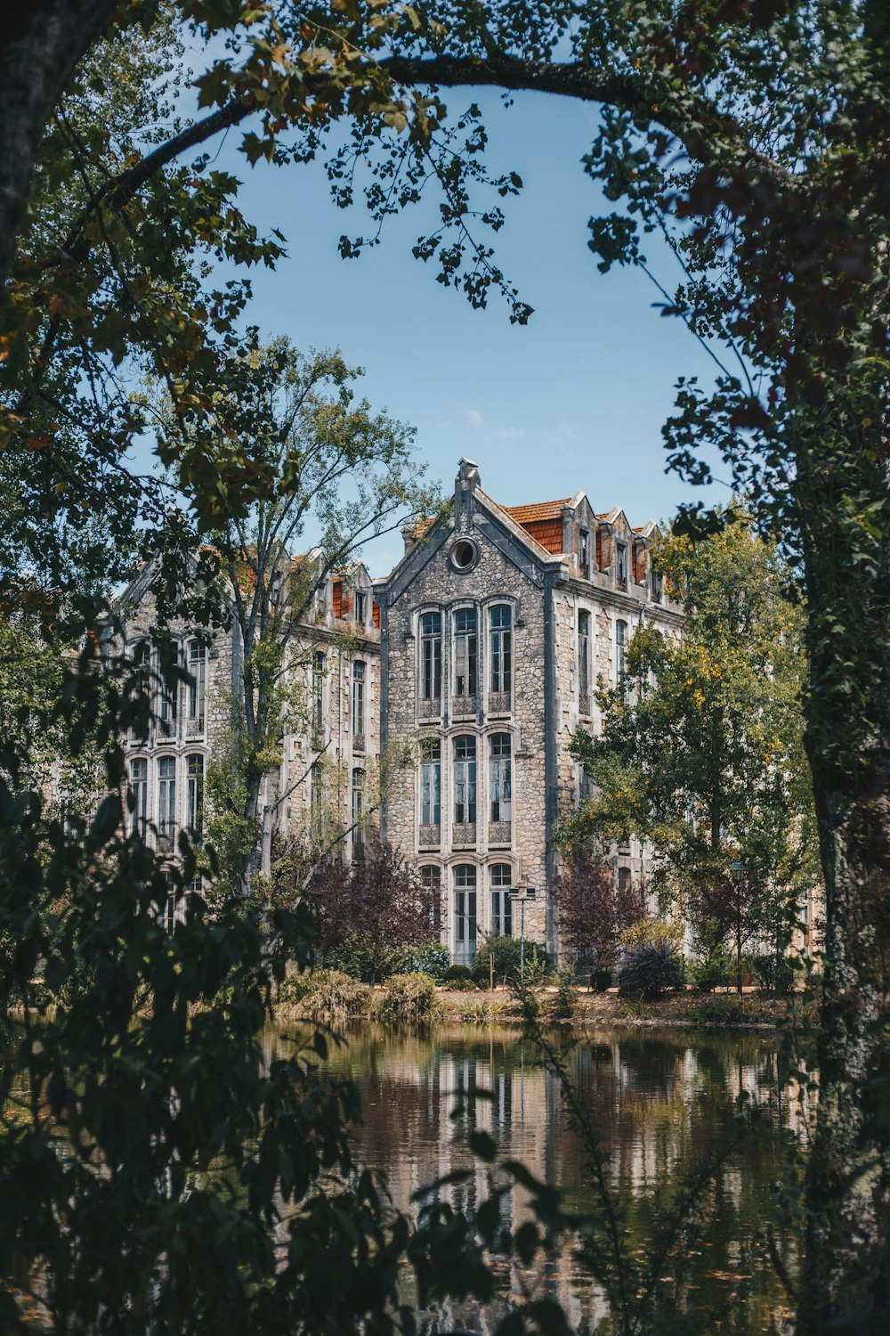 building near pond during day