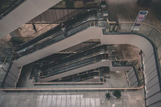 Busy commercial building elevator with people entering and exiting smoothly.