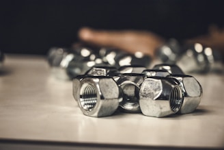A collection of different types of clinch nuts displayed on a white background.