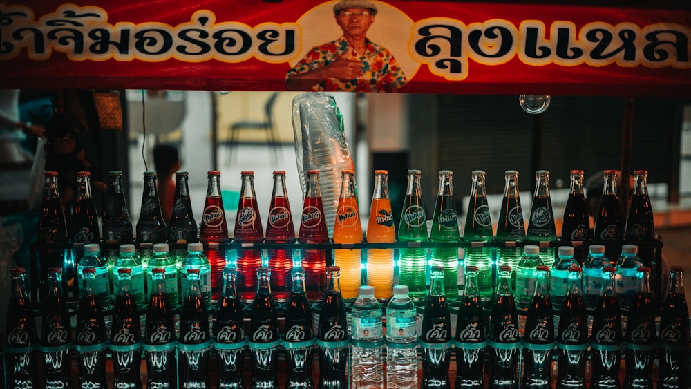 a display of bottles of various types and colors