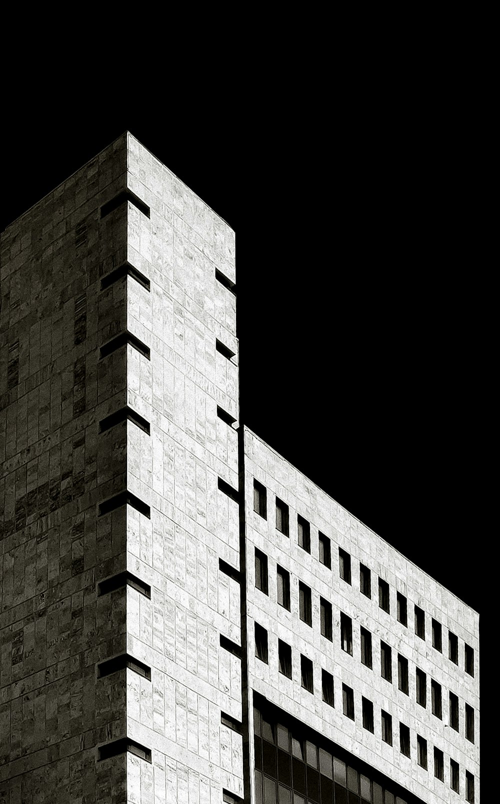 gray and brown high-rise concrete building