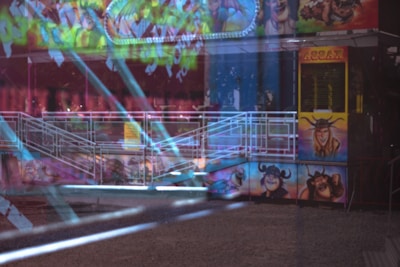 A colorful kiddie ride in a funfair setting.