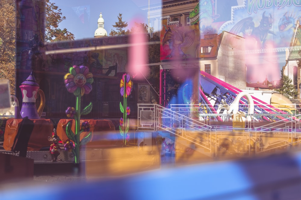 a view of a carnival ride through a window