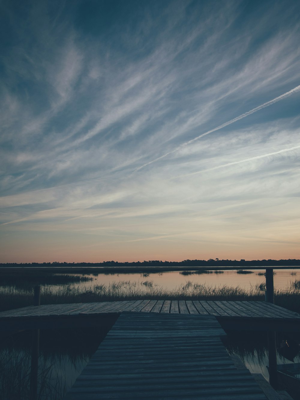 dock under cloudy sky