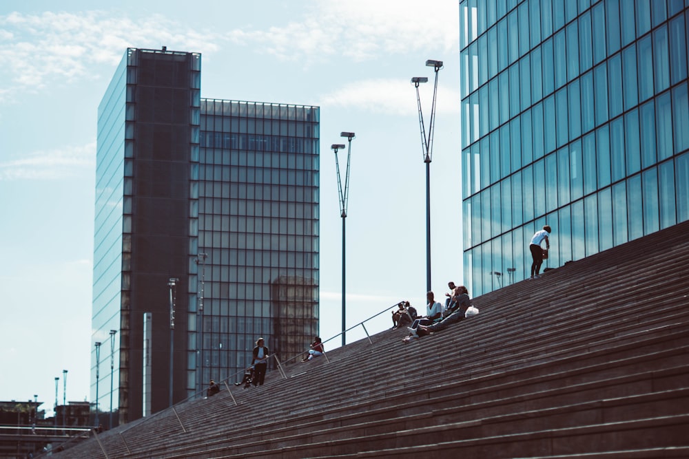 people on stairs near building