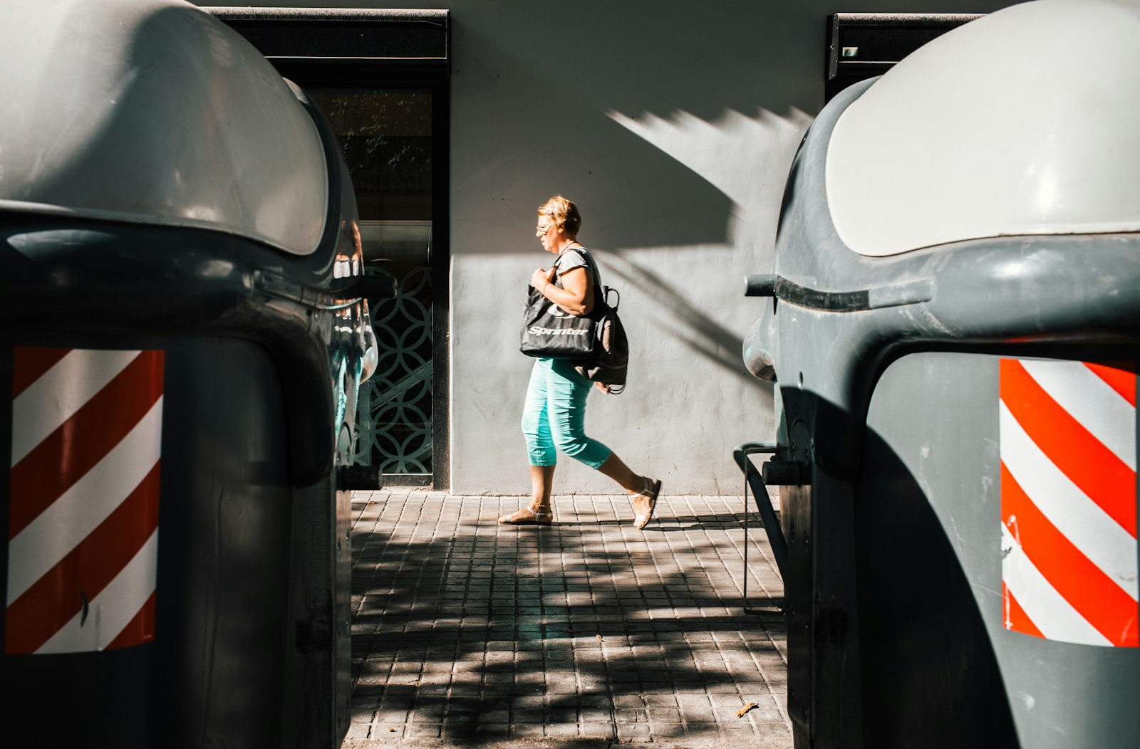 Leica M10-P sample photo. Woman walking on pavement photography