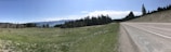 A panoramic view of a completed road project surrounded by natural landscape.