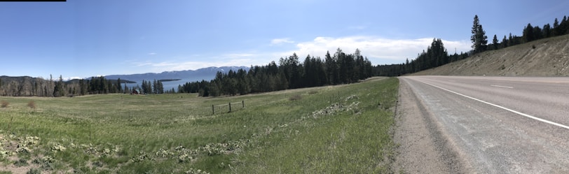 A panoramic view of a completed road project surrounded by natural landscape.