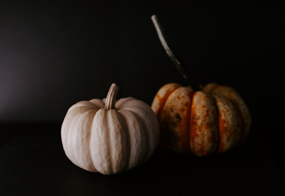 two green and yellow pumpkins