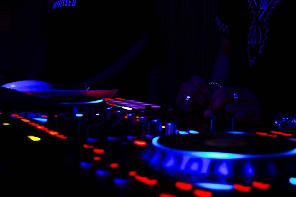 A vibrant radio studio with colorful lights and a DJ broadcasting live.