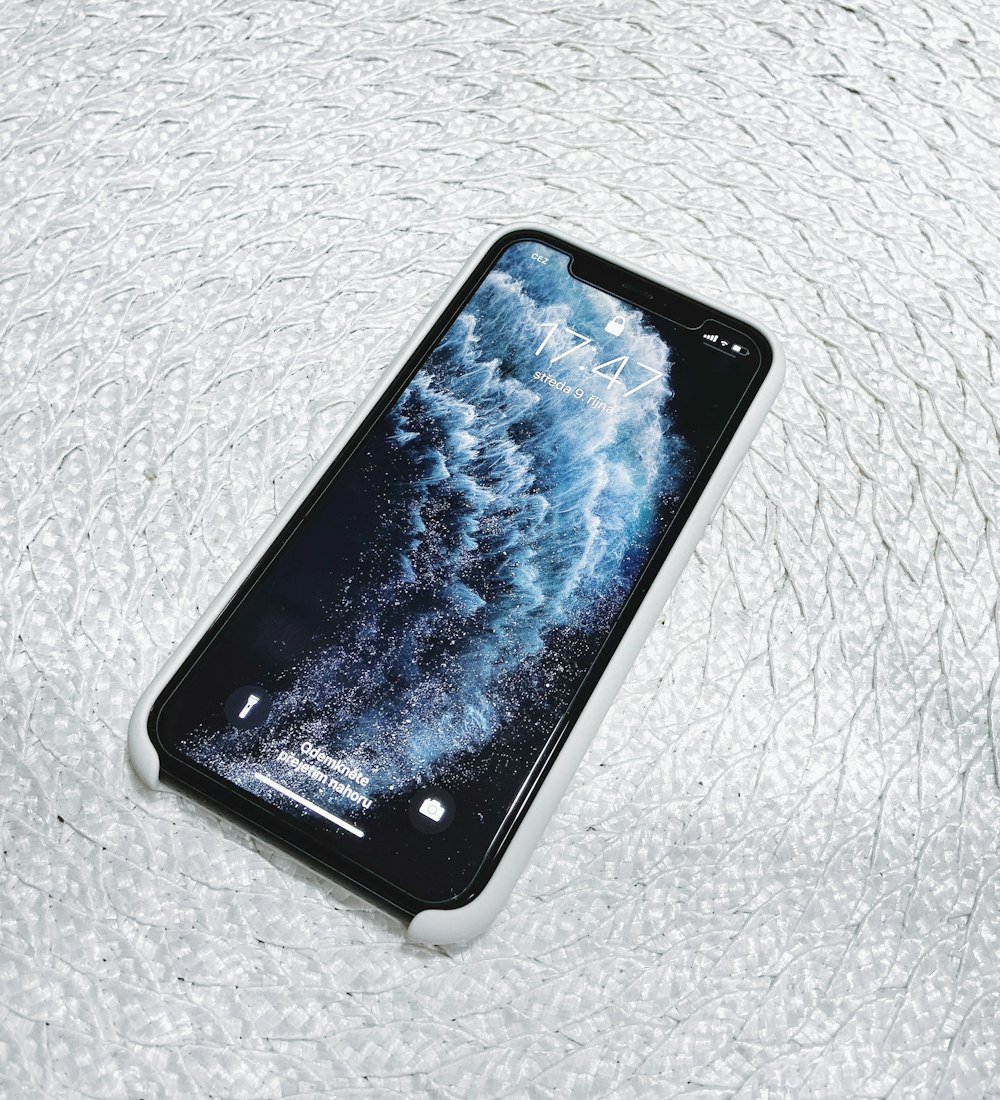 black Android smartphone on white surface