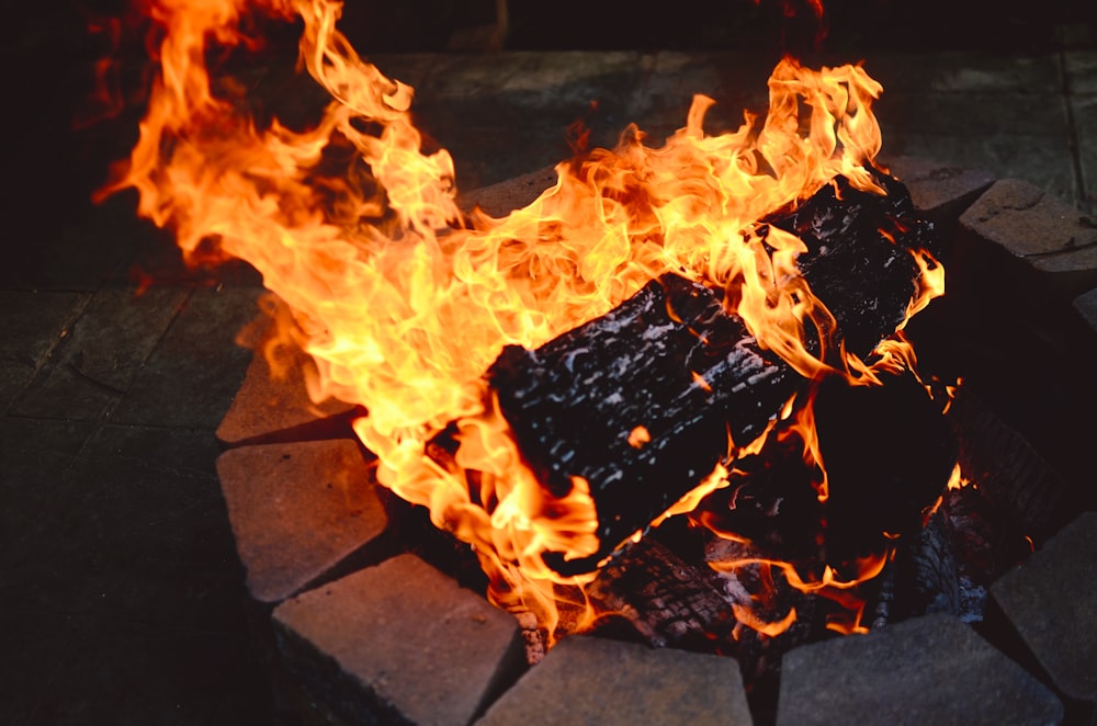 a close up of a fire pit on a stone floor