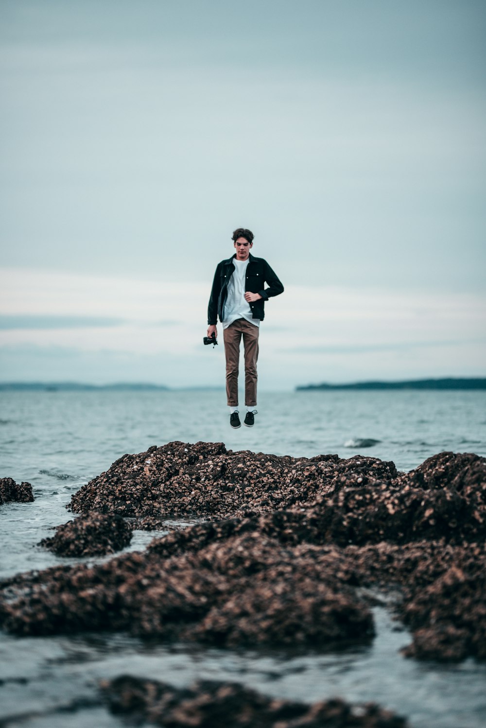 man standing on rock formation