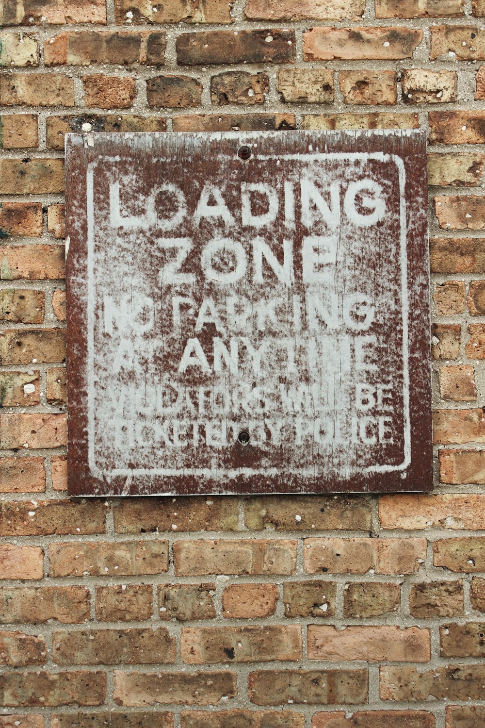 loading zone no parking at anytime signage