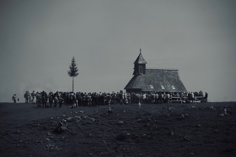 a group of people standing in front of a church