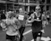 Photo of a marathon runner crossing the finish line, dynamic and full of emotion.