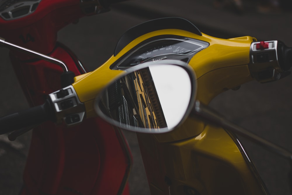 shallow focus photo of motorcycle side mirror
