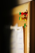 several needle pins on cork board
