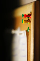 several needle pins on cork board