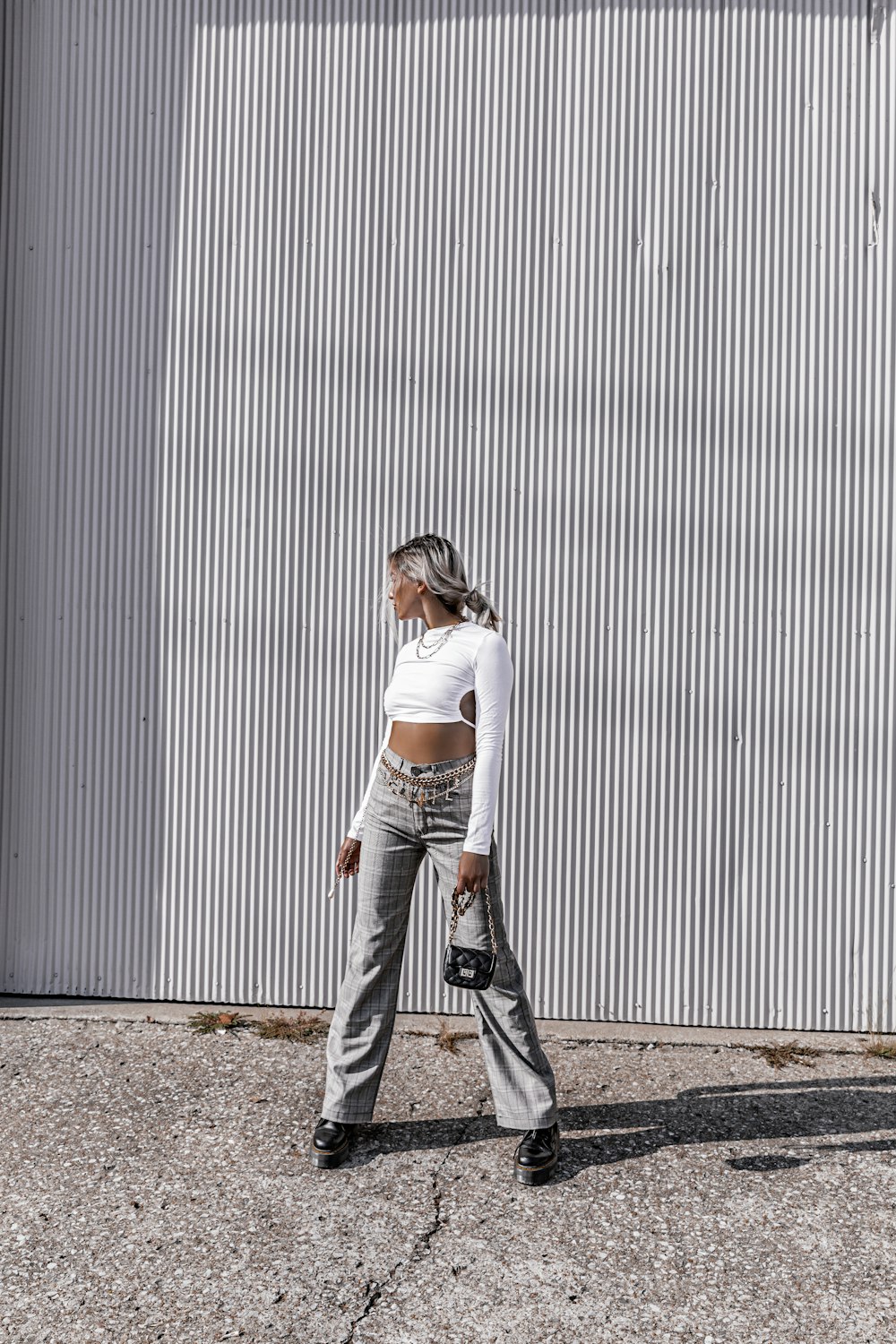 a woman standing in front of a building