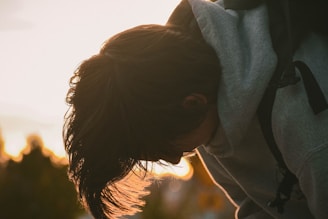 Close-up of a hoodie with a bold motivational quote, sunlight casting a warm glow.