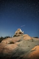 person standing on cliff at night