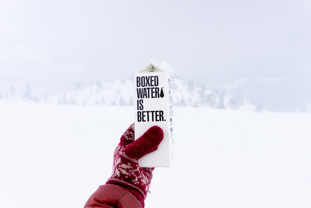 person holding boxer water is better printed carton box