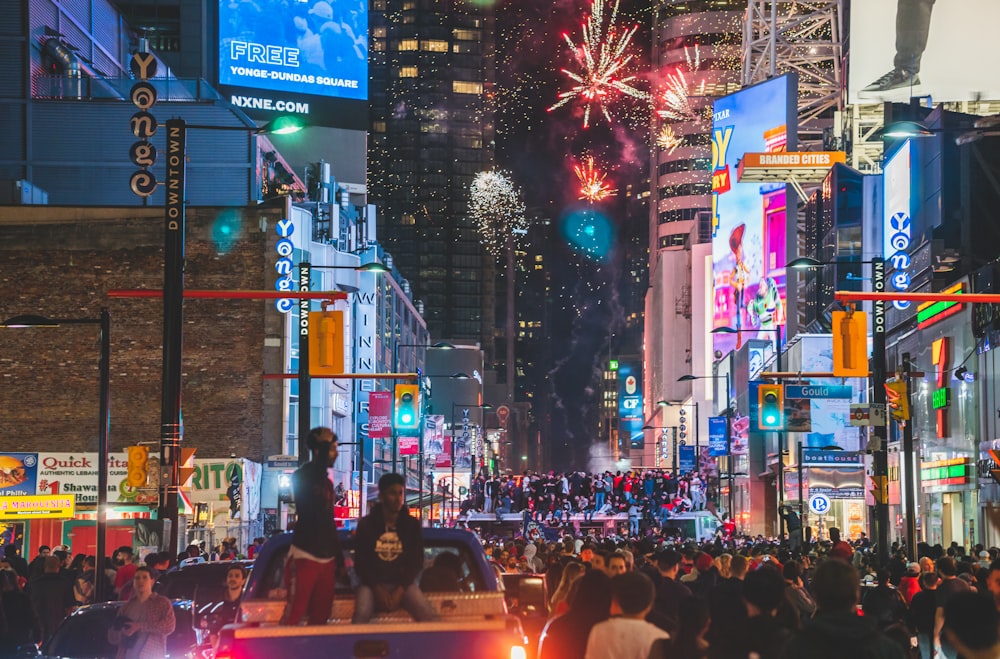 people at the street during fireworks