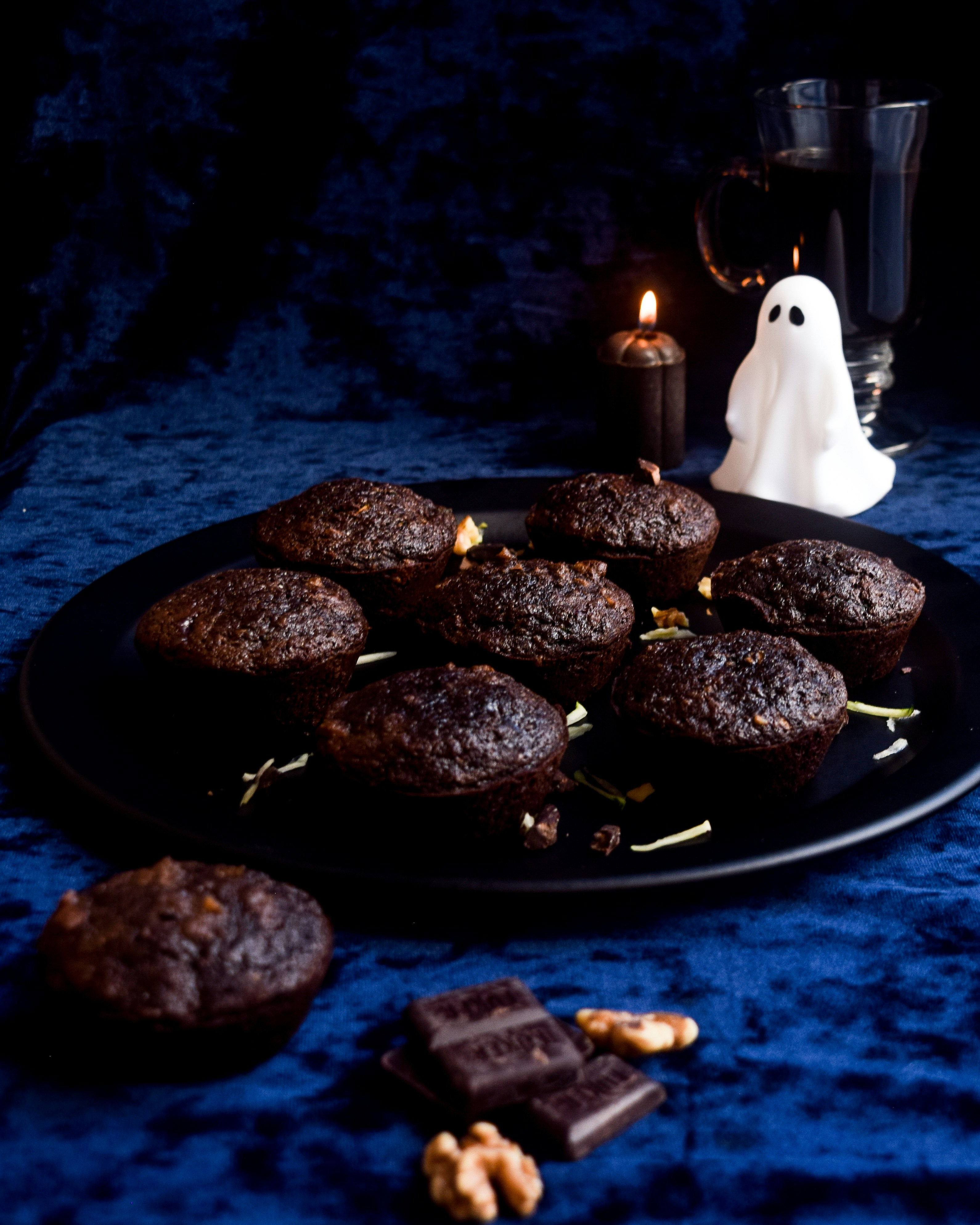 Image shows chocolate cakes on a plater with a halloween theme.