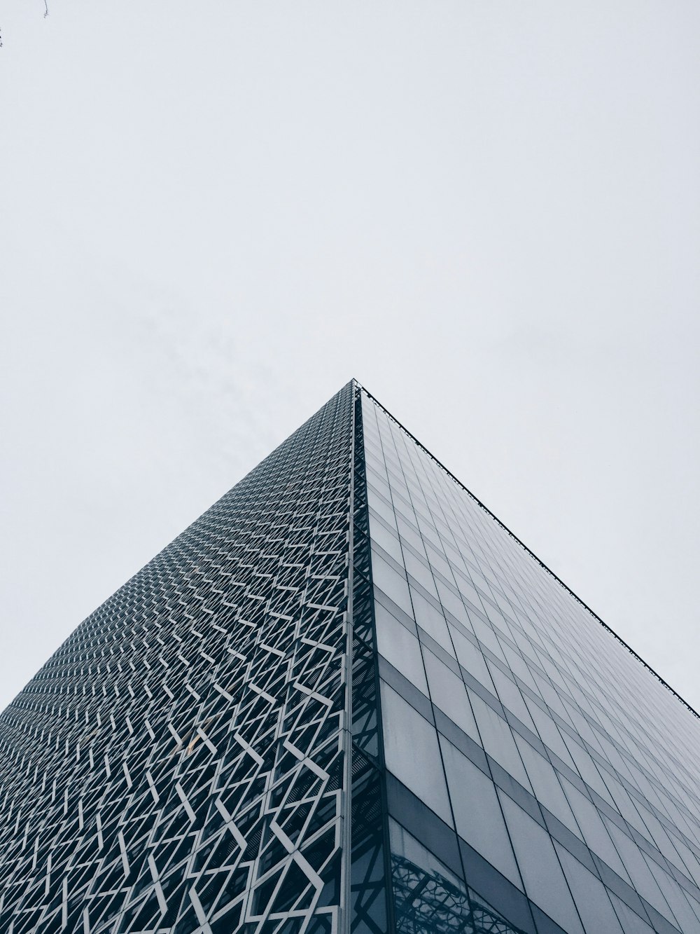 a very tall building with a sky background