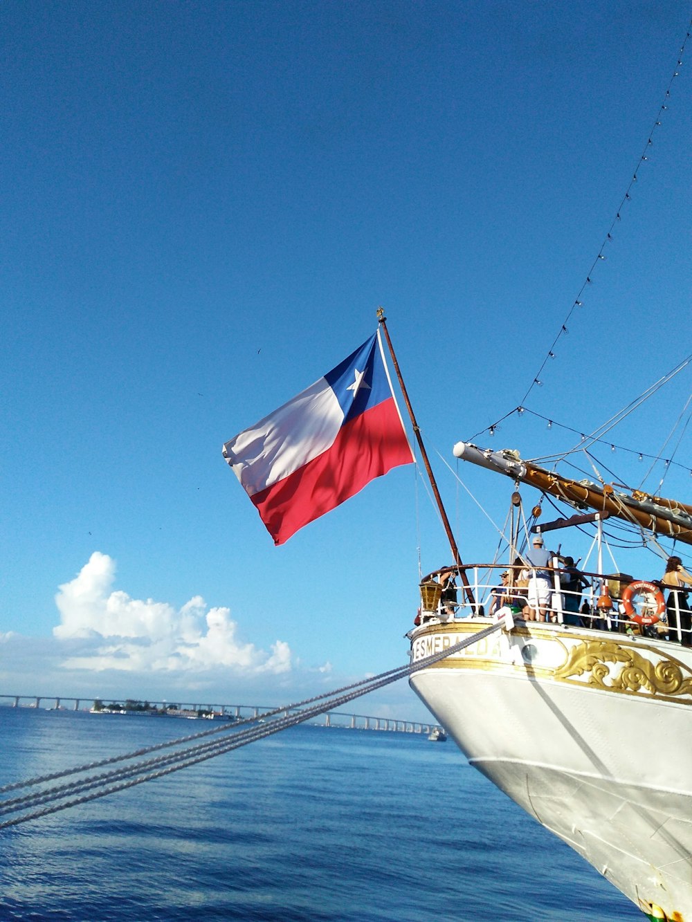 flag on boat above body of water