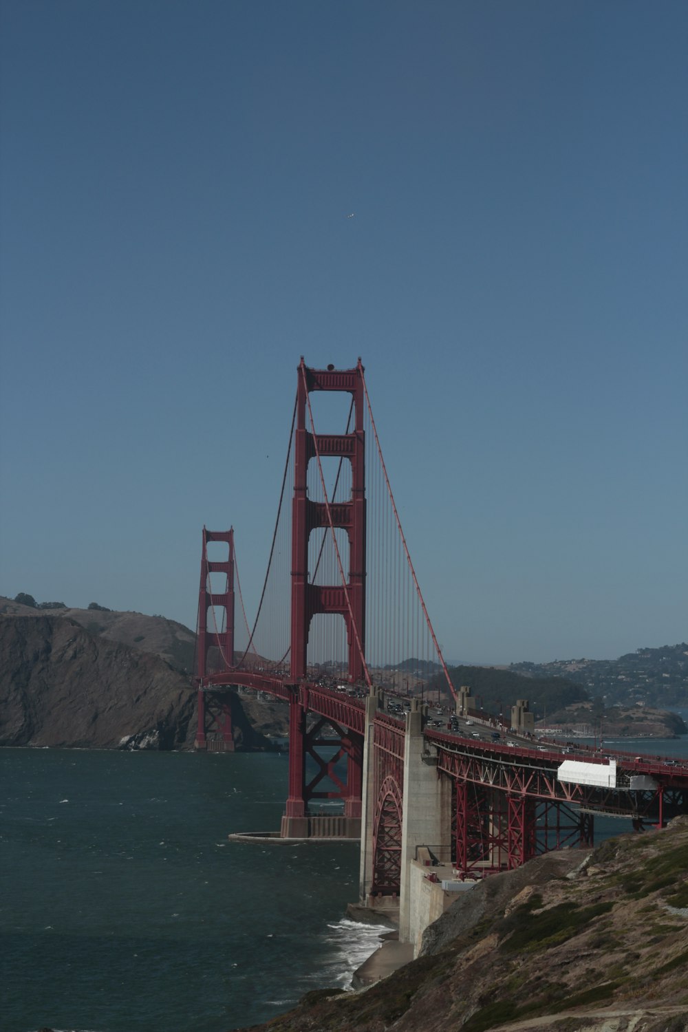 brown and gray concrete bridge under blue sky