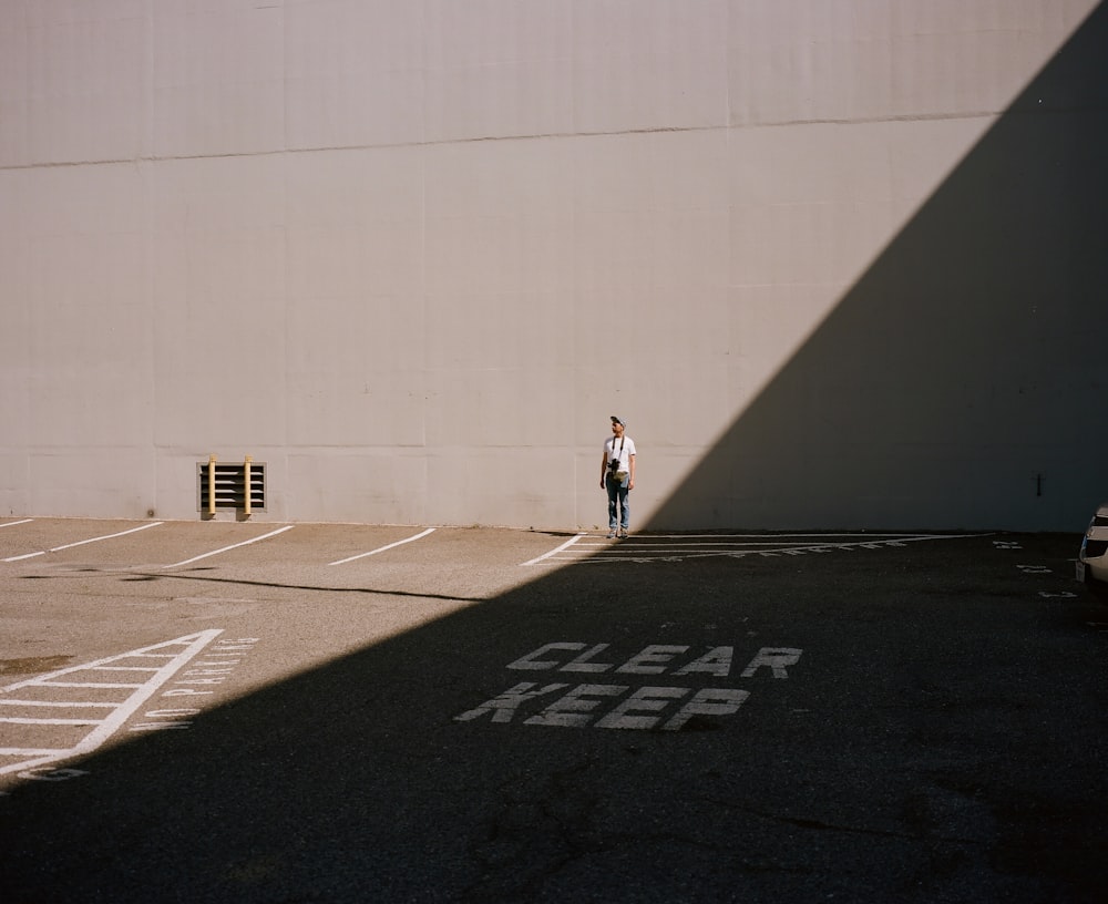 person standing against wall