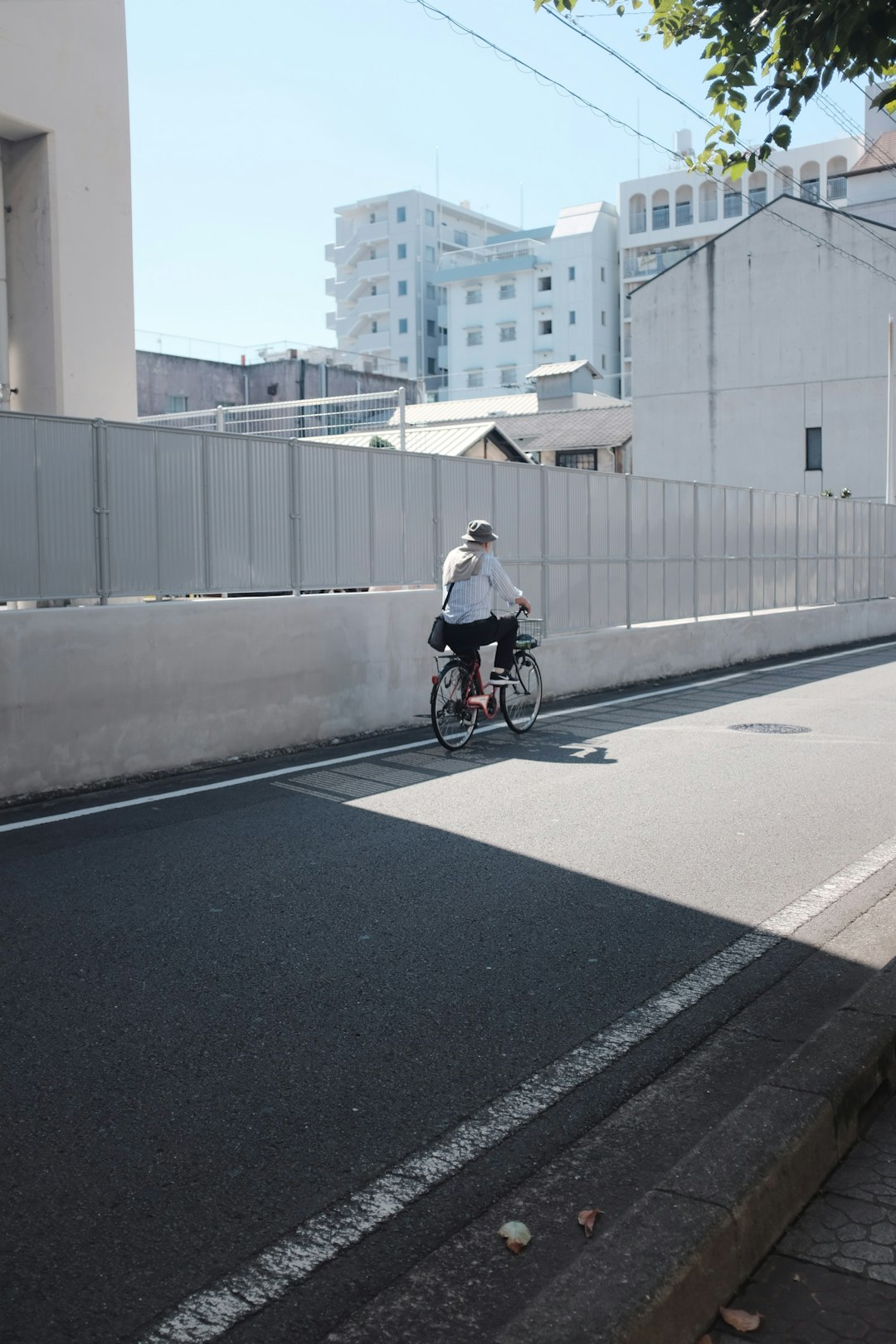 person cycling on road during daytime