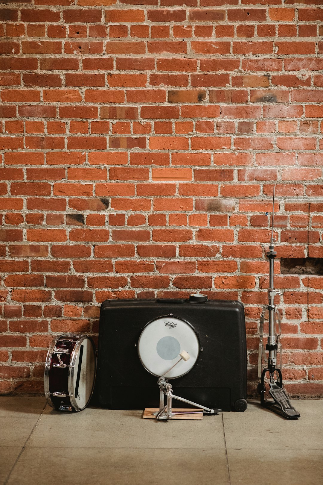 black and white snare drum near wall