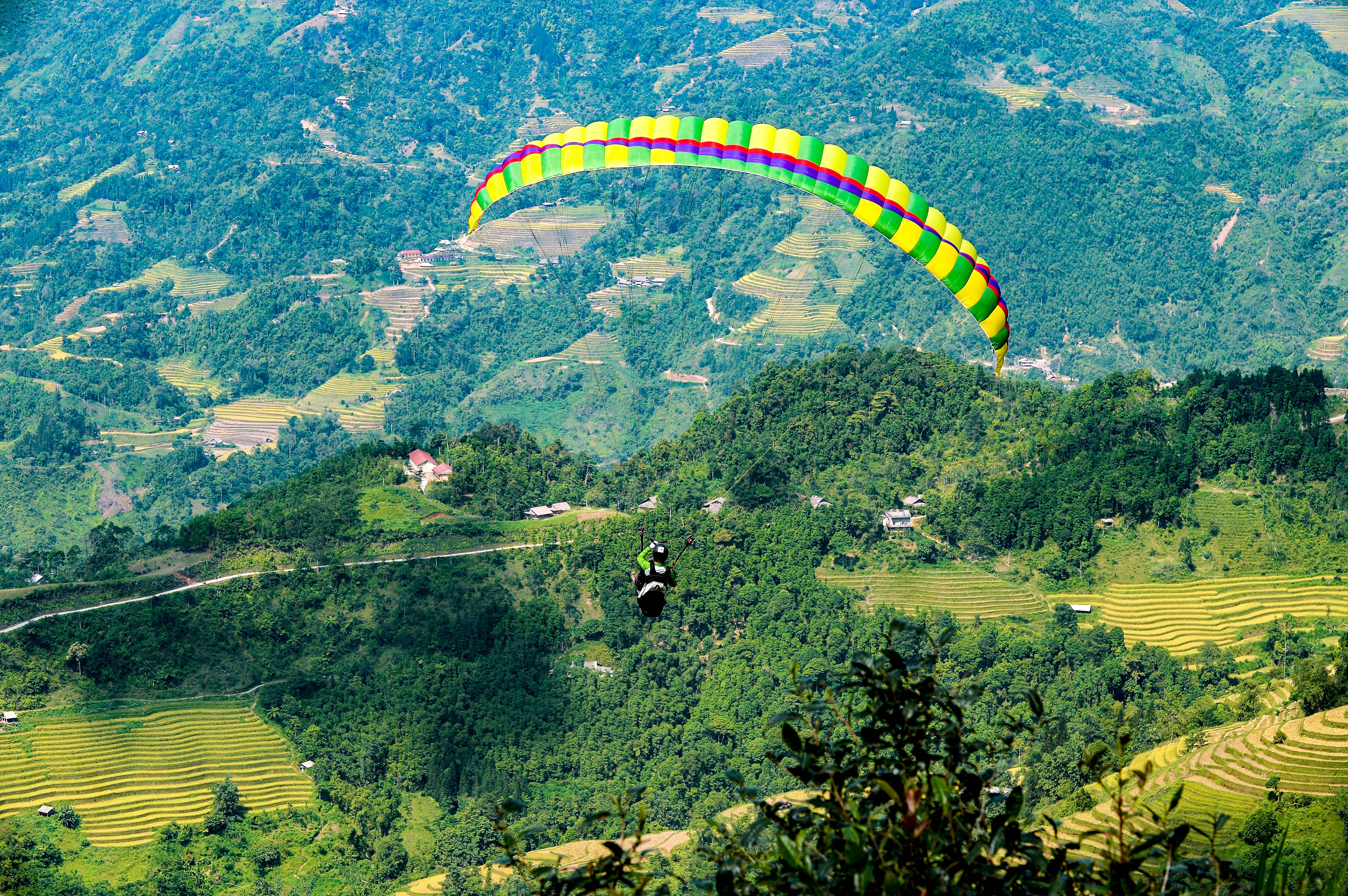 paraglider on terraces landscape