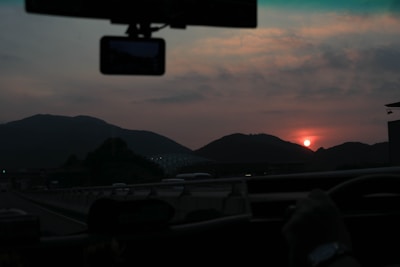 A scenic highway view during a smooth taxi ride from Haldwani to Delhi at sunset.