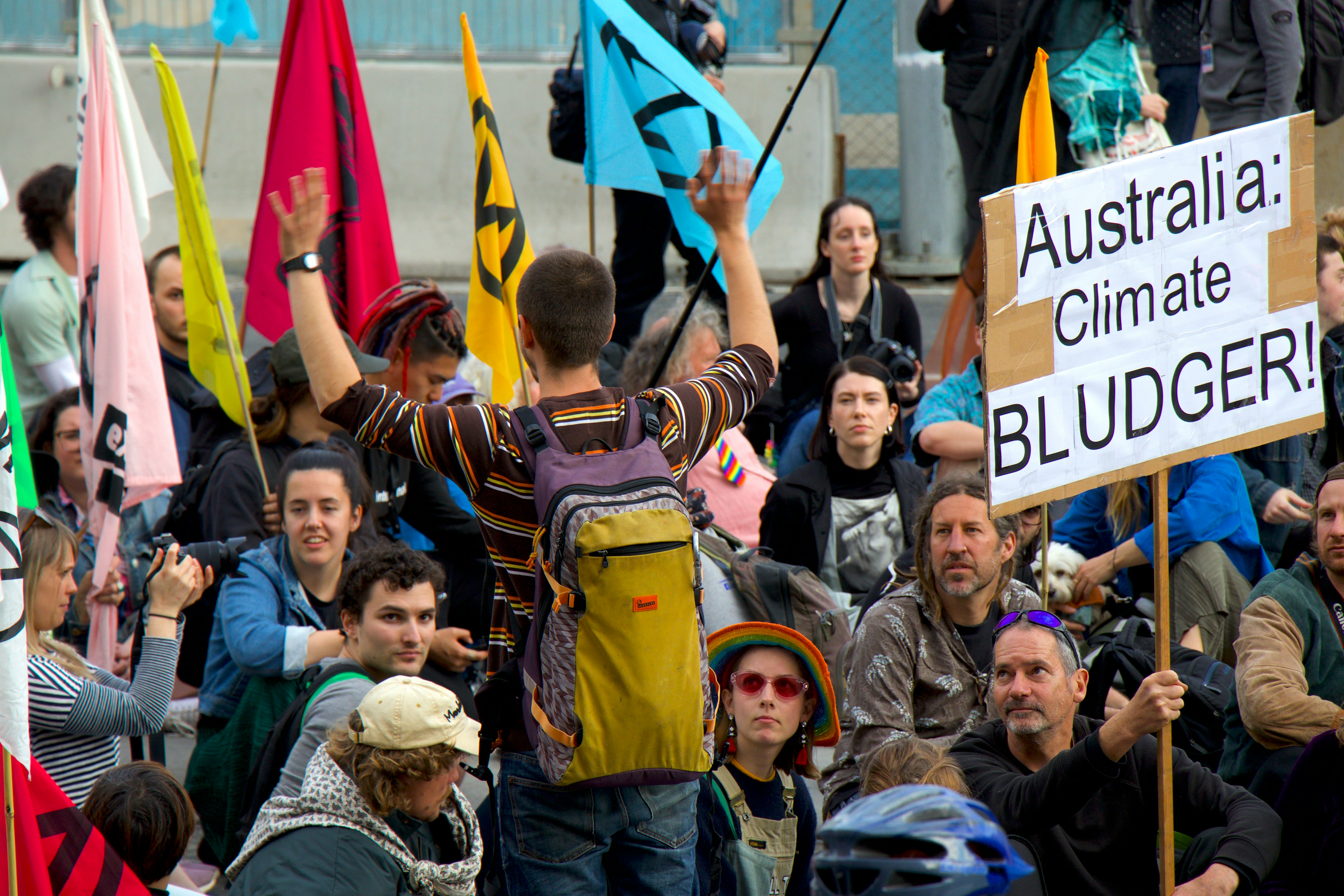 people holding signage