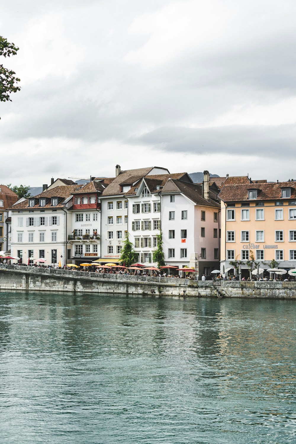 white painted buildings across body of water