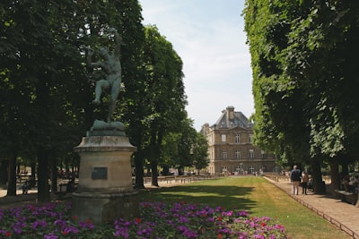 gray concrete statue and garden scenery