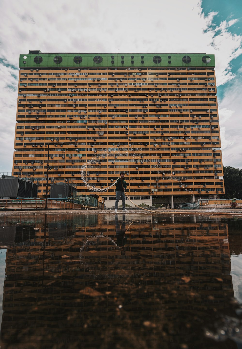 man standing near buildings during daytime