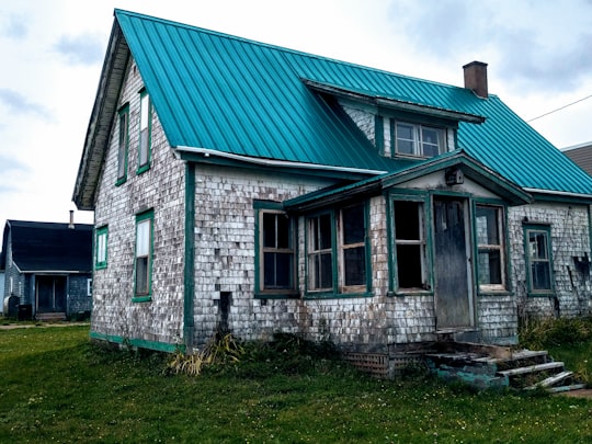 white brick house with green roof in Borden-Carleton Canada