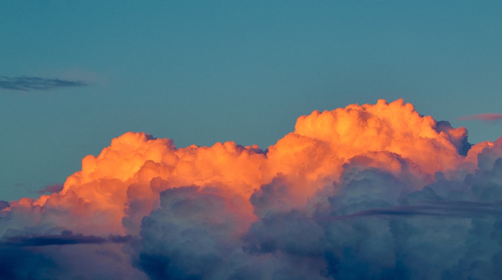 thick white cloud formation during golden hour